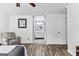 Relaxing main bedroom featuring wood-look flooring and an ensuite bathroom with a single vanity at 108 Everhill, Peachtree City, GA 30269