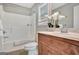 Bathroom with a bathtub and a wooden vanity at 722 Gittings Ave, Peachtree City, GA 30269