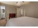 Spacious bedroom featuring neutral decor, hardwood furniture and an adjacent bathroom at 5687 Highway 212 N, Covington, GA 30016