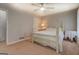 Comfortable bedroom with neutral decor, a cozy bed, and ample natural light at 5687 Highway 212 N, Covington, GA 30016