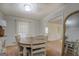 Well-lit dining room with a mirror and view to another room at 5687 Highway 212 N, Covington, GA 30016