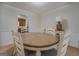 Cozy dining room with a wood table and neutral colored chairs at 5687 Highway 212 N, Covington, GA 30016