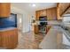 Well-equipped kitchen offering modern appliances and wood cabinetry at 5687 Highway 212 N, Covington, GA 30016