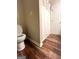 Bathroom with a shower and white shower curtain and wood-look floors at 650 Harris Dr, Locust Grove, GA 30248