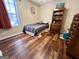 Cozy bedroom with wood-look floors and natural light at 650 Harris Dr, Locust Grove, GA 30248