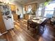 Eat-in kitchen featuring wood cabinets, breakfast nook, and wood-look flooring at 650 Harris Dr, Locust Grove, GA 30248