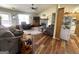 Cozy living room with fireplace, ceiling fan and wood look flooring at 650 Harris Dr, Locust Grove, GA 30248