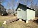 Exterior view of a shed with ramp access, nestled in a backyard with trees at 650 Harris Dr, Locust Grove, GA 30248