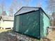 Exterior of metal storage shed with room to pull in car, truck, or tractor at 650 Harris Dr, Locust Grove, GA 30248