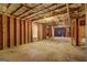 Unfinished basement featuring exposed ceiling with insulation and exposed beams at 205 Siesta Key Ct, Locust Grove, GA 30248