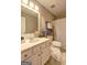 Bathroom featuring a vanity with a large mirror and a toilet with a curtained shower at 205 Siesta Key Ct, Locust Grove, GA 30248