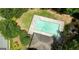 Aerial view showcasing a community pool with surrounding green spaces, providing a recreational amenity for residents at 11118 Benton Dr # F5, Covington, GA 30014