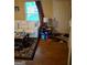 Cozy living room featuring hardwood floors, a white couch, and natural light at 6120 Raleigh Oaks Ct, Lithonia, GA 30058