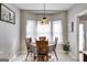 Dining area with seating for four and a large window for natural light at 47 Long Island Dr, Whitesburg, GA 30185