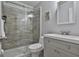 Updated bathroom featuring a tiled shower with glass door and modern vanity with sleek hardware at 100 Spincast Ct, Peachtree City, GA 30269