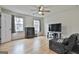 This bedroom has beautiful hardwood floors and neutral walls at 100 Spincast Ct, Peachtree City, GA 30269