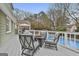 Entertain guests on this deck with seating around a fire pit and a view of the inviting pool at 100 Spincast Ct, Peachtree City, GA 30269