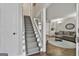 Inviting foyer showcasing a staircase leading to the upper level and a glimpse into the living area at 100 Spincast Ct, Peachtree City, GA 30269