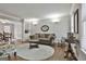 Bright living room with hardwood floors, a built-in bookcase, and a cozy seating area at 100 Spincast Ct, Peachtree City, GA 30269