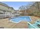 Refreshing backyard pool with a spacious deck, perfect for outdoor relaxation and entertainment at 100 Spincast Ct, Peachtree City, GA 30269