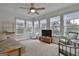 Bright sunroom featuring tile floors, large windows, and cozy seating, perfect for relaxation at 100 Spincast Ct, Peachtree City, GA 30269