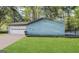Single-story home featuring a clean-looking garage, a deck, and is surrounded by mature trees at 3756 Bright Star Rd, Douglasville, GA 30135