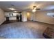 Spacious open-concept living room and kitchen area featuring modern appliances and ceiling fan at 3756 Bright Star Rd, Douglasville, GA 30135