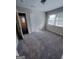 Bedroom with neutral walls, and carpet floors featuring natural lighting from the windows at 3401 Longleaf Dr, Decatur, GA 30032