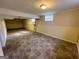 Unfinished basement space with tile flooring, offering potential for customization at 128 Sewanee Nw Ave, Atlanta, GA 30314