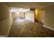 Spacious unfinished basement with access to stairs and a door, offering great potential at 128 Sewanee Nw Ave, Atlanta, GA 30314