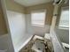 Clean bathroom with a tub, shower, granite countertop vanity, and tiled walls at 128 Sewanee Nw Ave, Atlanta, GA 30314