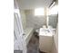 Updated bathroom with a tiled tub, shower, and new vanity at 128 Sewanee Nw Ave, Atlanta, GA 30314