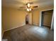 Spacious bedroom with a ceiling fan, plush carpeting, and a large closet at 128 Sewanee Nw Ave, Atlanta, GA 30314