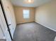 Cozy bedroom with a large window, neutral carpeting and walls at 128 Sewanee Nw Ave, Atlanta, GA 30314