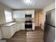 Modern kitchen with stainless steel appliances, granite countertops, and white cabinetry at 128 Sewanee Nw Ave, Atlanta, GA 30314