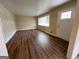 Bright living room featuring hardwood floors, neutral walls, and a sunlit window at 128 Sewanee Nw Ave, Atlanta, GA 30314