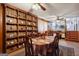 Large dining room with an adjacent staircase and a vintage-style cupboard and shelving at 1387 John Robert Dr, Morrow, GA 30260