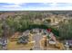 Aerial view of the property showing a well-maintained lawn, landscaping, and neighborhood streets at 704 Davenport Ct, Stockbridge, GA 30281