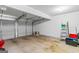 Spacious garage with ample room for parking and storage, featuring a functional door and ladder at 704 Davenport Ct, Stockbridge, GA 30281