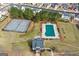 Bird's eye view of the community recreation area, featuring tennis courts, a pool, and walking trails at 704 Davenport Ct, Stockbridge, GA 30281