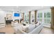Bright and airy living room with a fireplace, hardwood floors, and lots of natural light at 5769 Tillman Way, Powder Springs, GA 30127