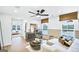 Cozy living room with a stylish ceiling fan and an adjacent bedroom at 5769 Tillman Way, Powder Springs, GA 30127