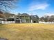 Large backyard featuring a screen porch and level lot at 642 Grecken Grn, Peachtree City, GA 30269