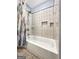 Bathroom featuring a white tiled shower/tub with a gray curtain at 642 Grecken Grn, Peachtree City, GA 30269