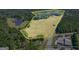 Aerial view of a large estate with pond and bordered by trees at 4226 Highway 155 N, Stockbridge, GA 30281