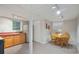 Basement kitchen and dining area featuring laminate flooring and white walls at 4226 Highway 155 N, Stockbridge, GA 30281