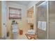 Bright bathroom with natural light, tile flooring, and a glass enclosed shower at 4226 Highway 155 N, Stockbridge, GA 30281