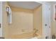 Full bathroom featuring a bathtub with tile surround, and yellow tiling at 4226 Highway 155 N, Stockbridge, GA 30281