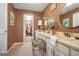 Bathroom with dual vanity and access to the walk-in closet at 4226 Highway 155 N, Stockbridge, GA 30281