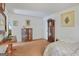 Spacious bedroom with carpet flooring, an antique grandfather clock, and bright natural light at 4226 Highway 155 N, Stockbridge, GA 30281